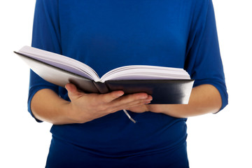 Young woman reading a book.