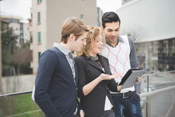 Multiracial business people working outdoor in town