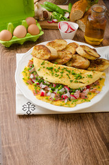 Omelette with spring vegetables and bacon