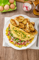Omelette with spring vegetables and bacon