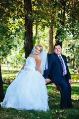 Bride and Groom at wedding Day walking Outdoors on spring nature