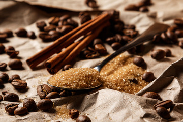 Spoon with brown sugar and coffee beans