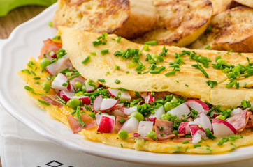 Omelette with spring vegetables and bacon
