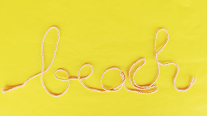 BEACH words advert on Yellow