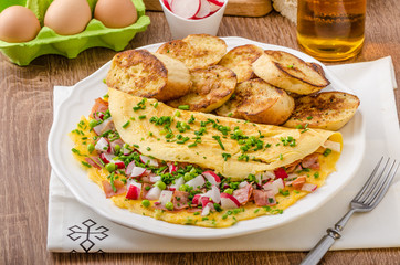 Omelette with spring vegetables and bacon