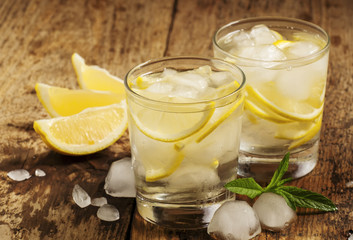 Fresh water with lemon, mint and ice, selective focus