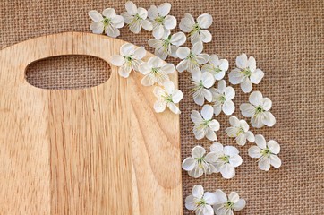 Culinary background wooden plank decorated with spring blossom