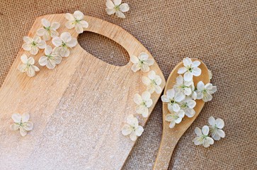 kitchen utensils decorated spring flowers cloth background