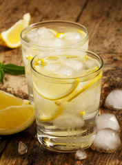 Fresh water with lemon, mint and ice, selective focus