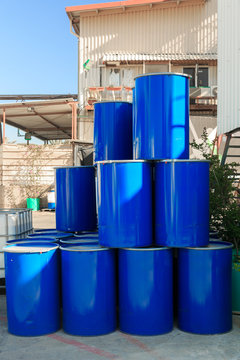 Blue barrels on a chemical plant