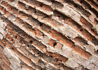 Fragment of the old wall of the destroyed bricks