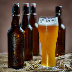 Glass and bottles of beer