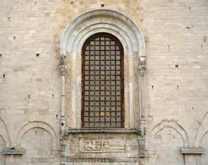 Fototapeta na wymiar Detail St Nicholas Basilica, window of elephants - Bari