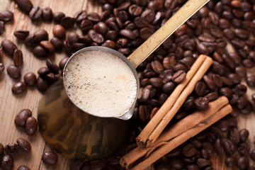 Old coffee pot on wooden rustic background
