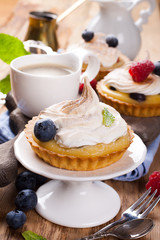 Homemade tartlets with lime curd and meringue 