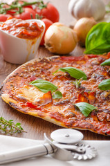 Cheese pizza with chilli and basil