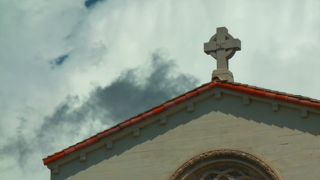 Time-lapse clouds behind a Spanish architecture style church.