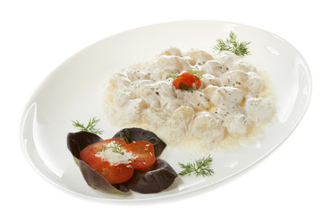 Gnocchi with white truffle sauce. Isolated on white.