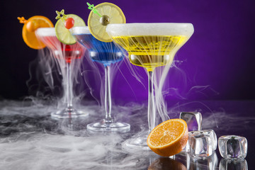 Cocktails with ice vapor on bar desk