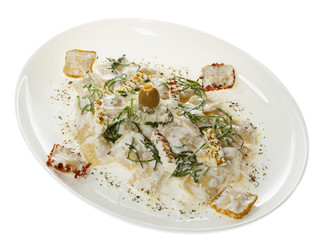Ravioli in white sauce isolated on white