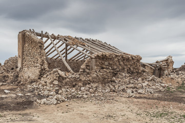 Ruins of an old stone house in rural setting