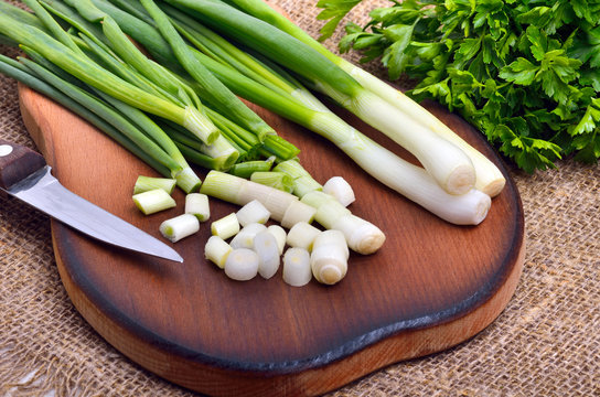 Chopped green onions with parsley  and knife