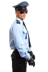Policeman in sunglasses holds nightstick on white background