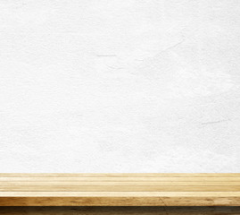 Empty wooden table over white cement wall, Product display