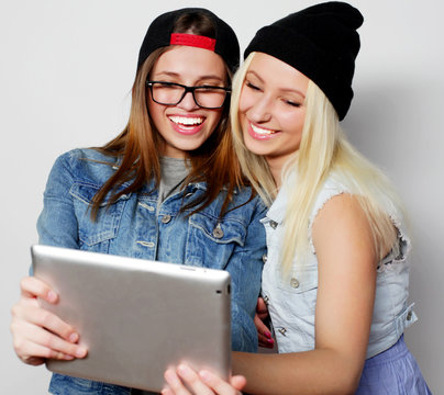  girls taking a self portrait with a tablet