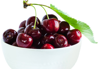 Cherry berries in a cup on a white background