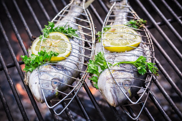 Tasty fish with lemon and herbs for grilling