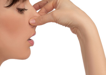 Image with woman's face holding her nose with hand