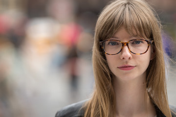 Young caucasian woman serious face portrait