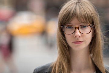 Young caucasian woman serious face portrait