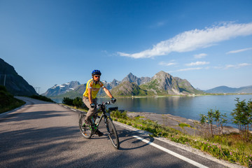 Fototapeta premium Biking in Norway against picturesque landscape