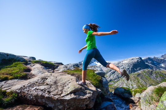 Woman Takes Rest On Top Of Mountain In Norway