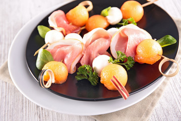 buffet food with melon,mozza and prosciutto
