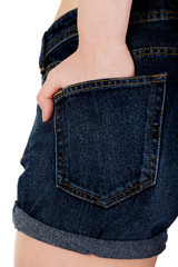 Woman's back in jeans shorts.