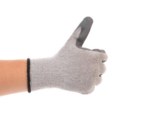 Thumb up of gray rubber glove on hand.