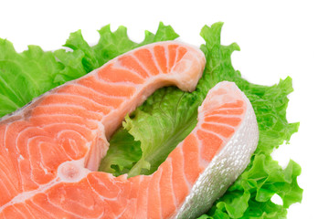 Fresh salmon steak on lettuce.