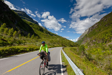 Obraz premium Biking in Norway against picturesque landscape
