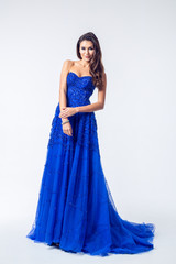 Young woman in a beautiful blue evening dress © fotofabrika