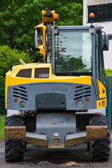 Excavator, construction vehicle, vied from the back.