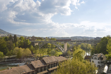 Fototapeta premium Bern and his train, river Aare, trees and rooftops, Europe
