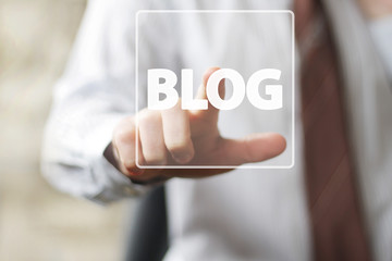 Businessman hand press web button blog sign