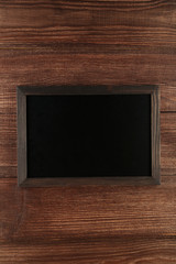 Wood frame on brown wooden background