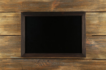 Wood frame on brown wooden background