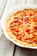 Fresh tomato pie on grey wooden background