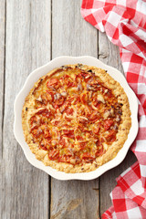 Fresh tomato pie on grey wooden background