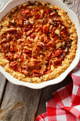 Fresh tomato pie on grey wooden background